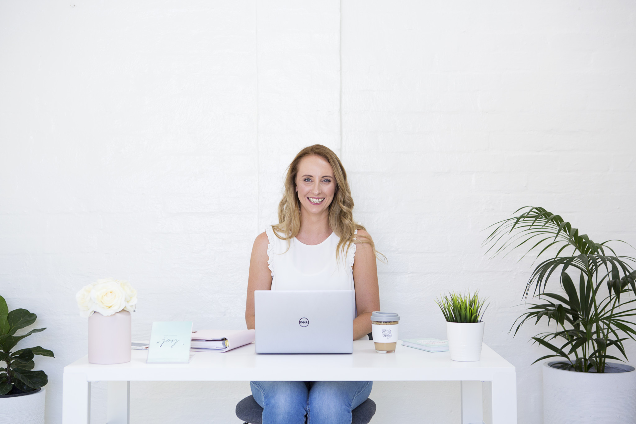 Rebecca Hawker sitting at desk